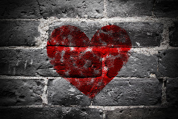 istock Painted Red Heart Shape on Black Brick Wall 471482210