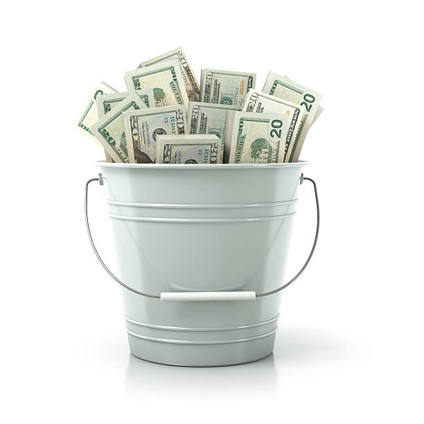 White metal bucket full of money stock photo