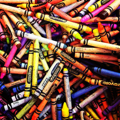 Easton, Pennsylvania, USA - September 12, 2012: A heap of Crayola brand crayons of various colors.  Crayola currently has 133 colors, with some color names being changed and 13 crayon colors retired since production began in 1958.