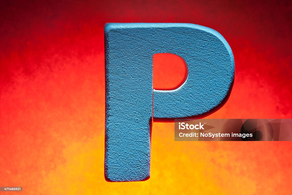 P, wood letter Wood letter "P", on red-orange background. Alphabet Stock Photo