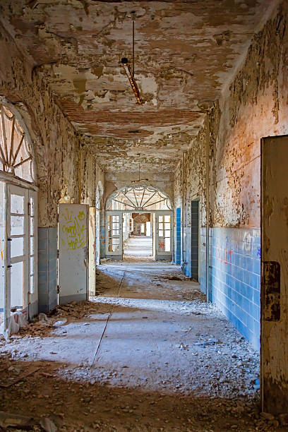 Abandoned sanatorium Corridor in the abandoned former sanatorium for tuberculosis sufferers "Beelitz-Heilstätten" (Brandenburg, Germany). beelitz stock pictures, royalty-free photos & images