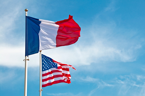 American and French flags in the sky