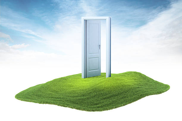 istock island with opened door floating in the air 471489020