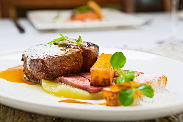 istock Char-grilled steak with unusual accompaniments in restaurant 471489237