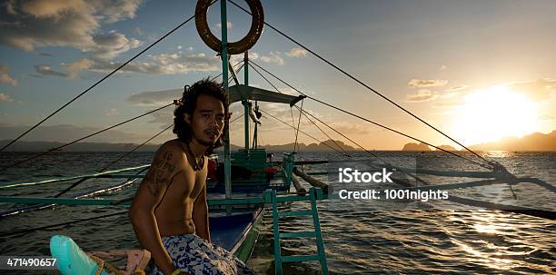 Philippino With His Traditional Banca Outrigger Boats In The Philippines Stock Photo - Download Image Now