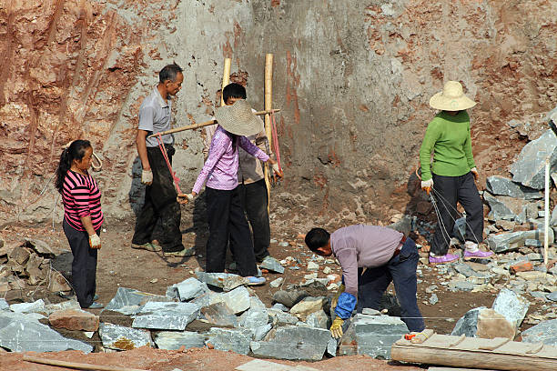 Workers Carrying Rocks 150+ Woman Carrying Cement Stock Photos, Pictures & Royalty-Free Images ...