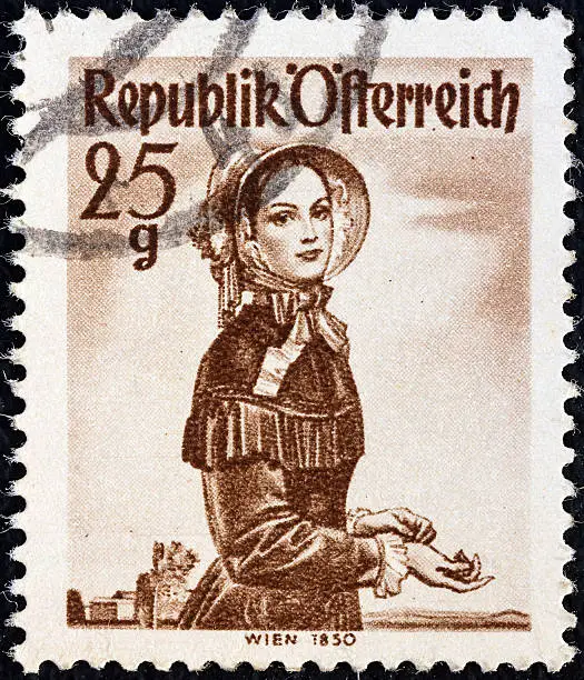 AUSTRIA - CIRCA 1948: A stamp printed in Austria from the "Provincial Costumes" issue shows a woman from Vienna (1850).