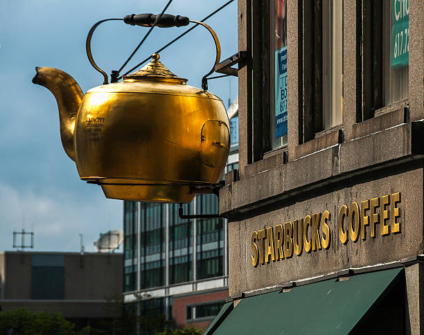 Boston Historic Gigantic Steaming Tea Kettle Now Over Starbucks stock photo