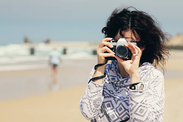 istock Woman with vintage retro camera 471492956