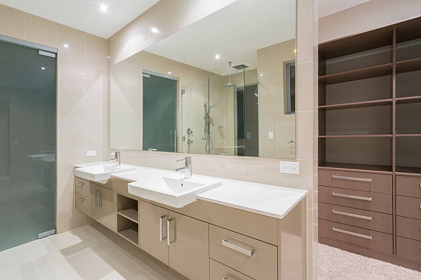 Double vanities and walk-in shower in a modern bathroom stock photo