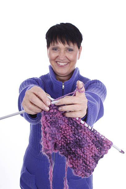 istock Elder woman with knitting 471493522