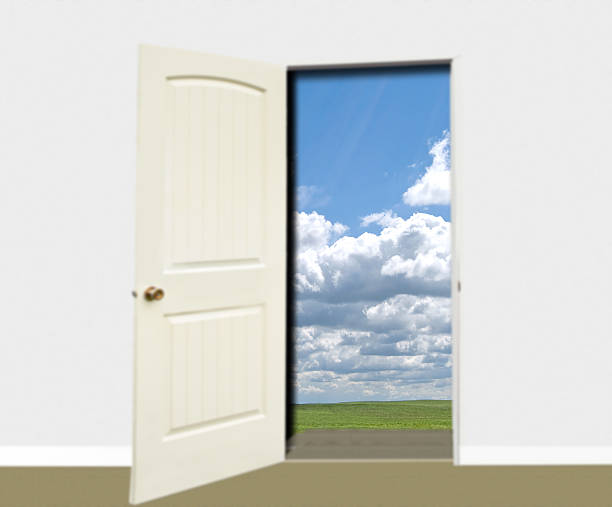 istock Room with door open  with grain field, blue sky, clouds 471494022