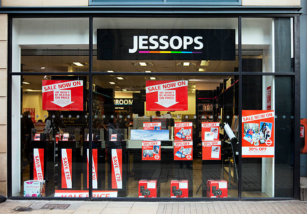 Jessops photographic store shop window, Sale signs and logo York, UK - December 27, 2012: Jessops shop window, signs and logo. Jessops was a British photographic retailing company founded in 1935. This is very shortly before the company collapsed into administration in early January 2013. closing down sale stock pictures, royalty-free photos & images