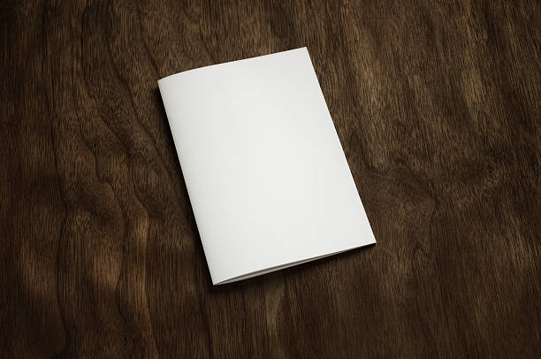 istock Blank brochure on a dark wooden background 471495479