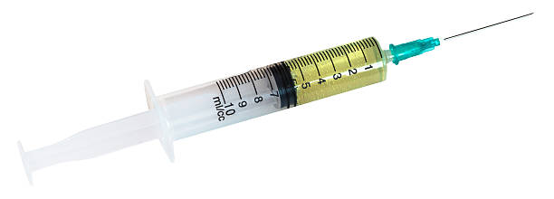 little una siringa contenente 10 ml di liquido giallo - surgical needle syringe prick injecting foto e immagini stock