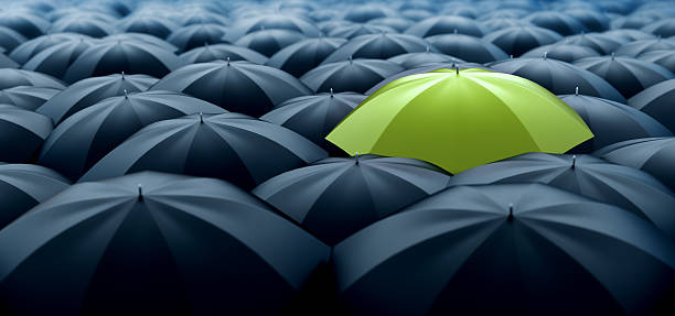 Green umbrella Improved, better and bigger size image of different, leader, best, unique, boss, individuality, original, special, worst, first, chief, champion and discrimination concept. Green umbrella in a row of white ones sayings stock pictures, royalty-free photos & images
