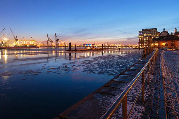The famous "Fischauktionshalle" of Hamburg Altona with ice on the elbe river.