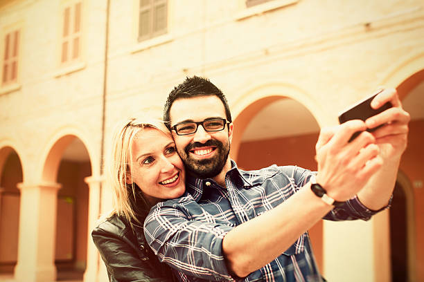 istock Young couple taking a selfie 471499660