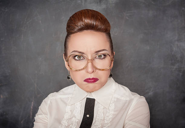 Angry teacher with eyeglasses stock photo