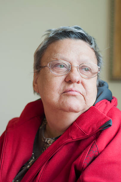 istock old woman wearing eyeglasses 471501397