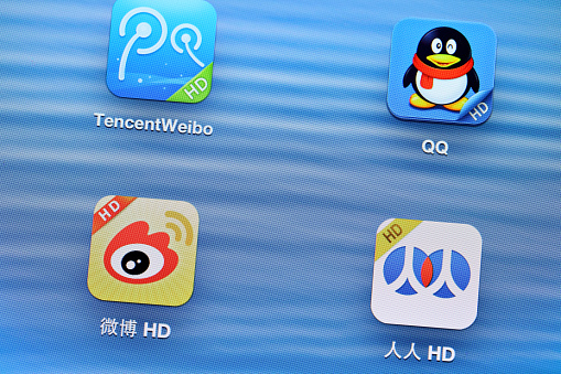Hong Kong , Hong Kong - April 18, 2013: China social media mobile application with tencentweibo, QQ and weibo on the tablet