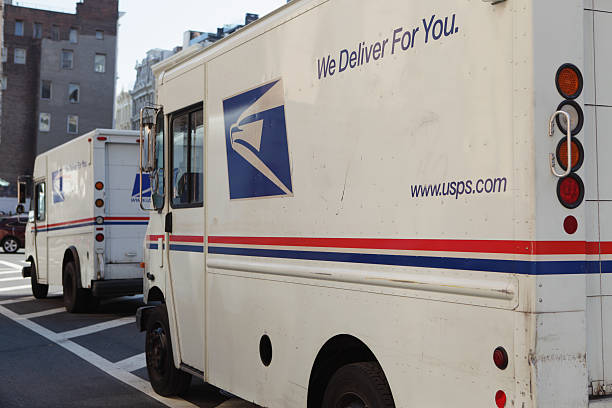 USPS mail delivery vans trucks NYC stock photo