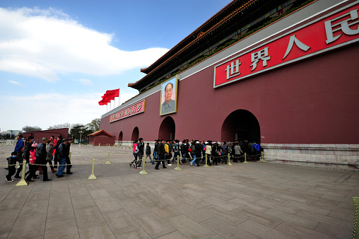 Beijing, China - April 1, 2013: Visitors going pass the famous Tiananmen Gate to go to the Forbidden City, Beijing in April 1, 2013.