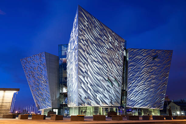 Belfast, Northern Ireland, UK - April 28th, 2013: Evening view of the 'Titanic Belfast' which is the name given to the Titanic Visitor Centre building which opened on the 31st of March 2012. It is located in the Titanic Quater of the city close to where the Titanic luxury cruise ship was built.. The new building is estimated to have cost ₤97 million and the four coners are designed to represent the hull of the Titanic. The ship sank after hitting an iceberg in 1912. Taken with Canon 5D Mark2.