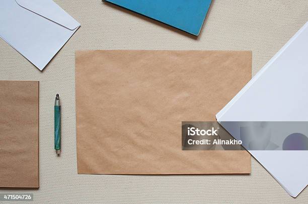 Empty Envelopes And Sheets Of Paper On The Table Stock Photo - Download Image Now - 2015, Above, Backgrounds