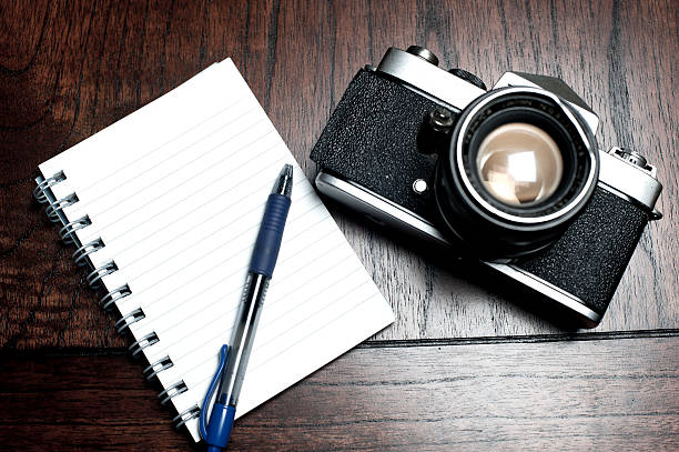istock Notepad and photography equipment 471504984