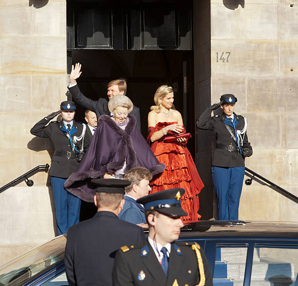 Amsterdam, The Netherlands - April 29, 2013: Willem-Alexander (Prince of Orange), Princess Máxima (Máxima Zorreguieta Cerruti) and Queen Beatrix of the Netherlands leaving the Royal Palace in Amsterdam the day befor the cronation of Prince Willem-Alexander. They where rehearsing for the big day ahead and now are leaving the Royal Palace to have a Royal dinner with guest.