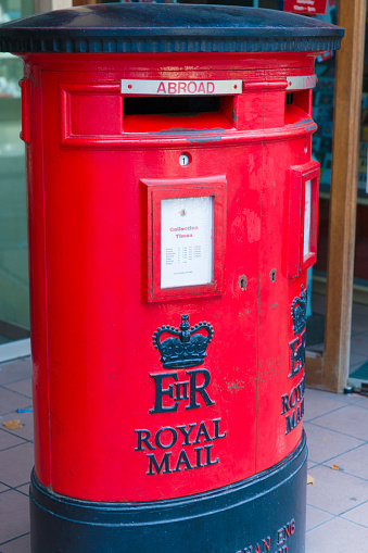 Gibraltar, United Kingdom - August 08, 2012: A red post box of the British Post Office in Gibraltar, UK. Close-up shot. Royal Mail is the state-owned postal service in the UK.