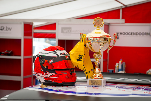 Zolder, Belgium - 21 April, 2013: Golden winner's cup and helmet on top of the Veka Racing Ferrari 458 GT2 in the paddock before the 2013 race at Zolder. The car is participating in the 2013 Supercar Challenge.