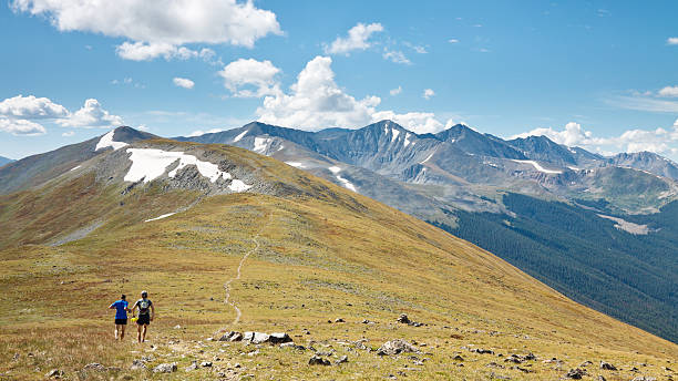 Trail Running in the Rocky Mountains, Colorado Ten Mile Range, Colorado, USA - August 28, 2011: Two trail runners on the Colorado Trail in the Rocky Mountains. tenmile range stock pictures, royalty-free photos & images