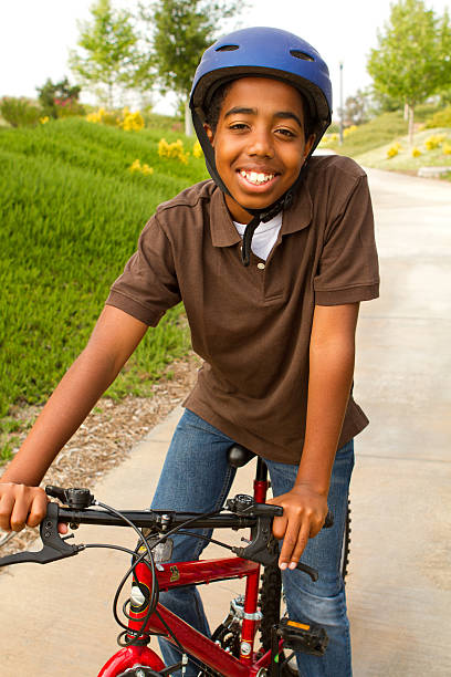 istock African American kid riding a bike. 471508116
