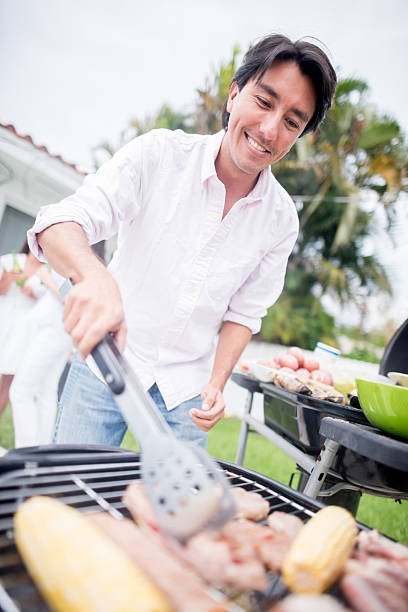 istock Man cooking a BBQ at home 471508386