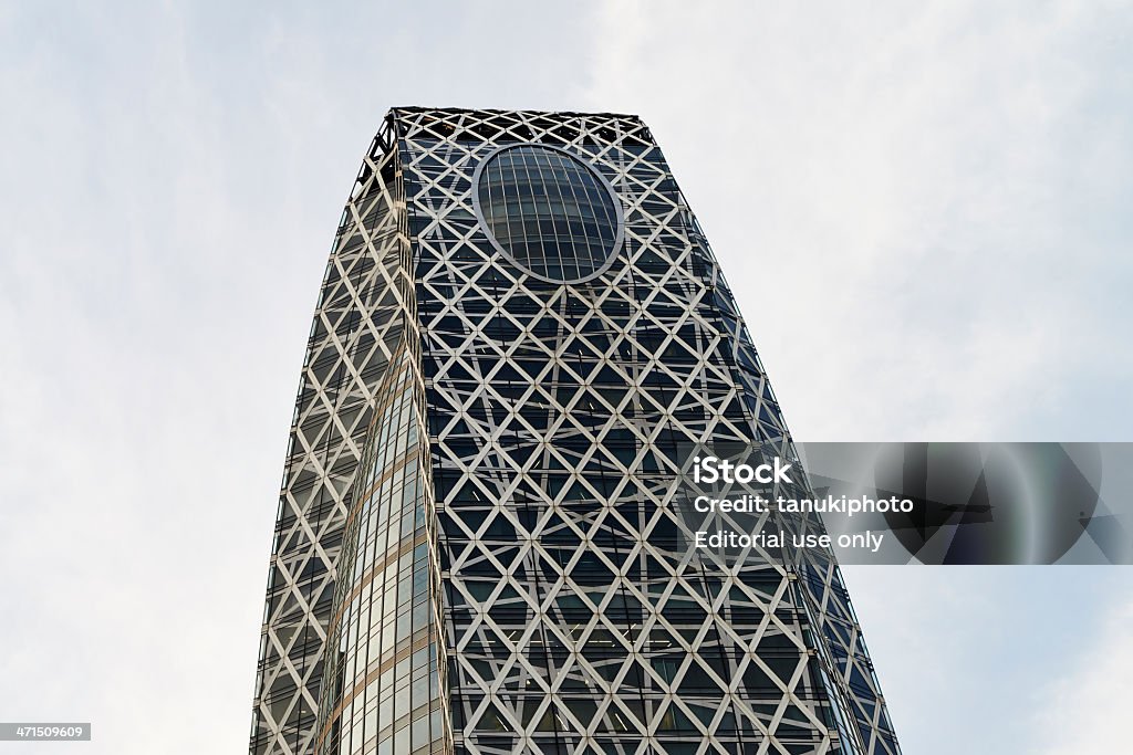 Mode Gakuen Cocoon Tower Tokyo, Japan - March 7, 2013: exterior view of Mode Gakuen Cocoon Tower, a modern skyscraper with cocoon-like structure located in Shunjuku district. Mode Gakuen Cocoon Tower Stock Photo