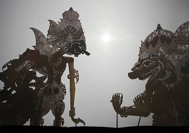 Traditional Indonesian shadow puppet theatre wayang kulit Yogyakarta, Indonesia - August 13, 2011: Traditional Indonesian shadow puppet theatre wayang kulit performs in street in Yogyakarta, Central Java, Indonesia. wayang kulit stock pictures, royalty-free photos & images