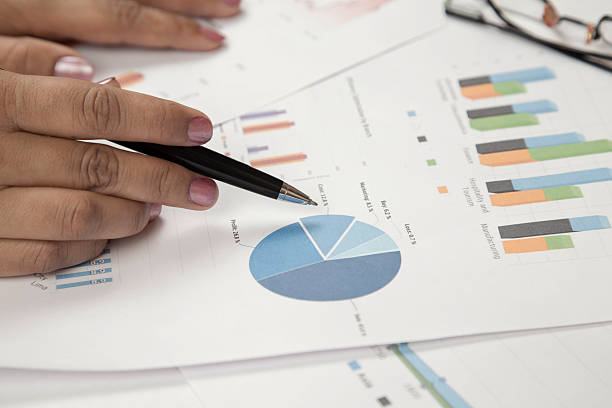 istock Businesswoman analyzing business reports 471512480
