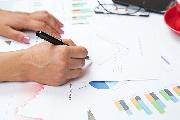 istock Businesswoman checking business reports 471512486