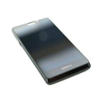 Florence, italy - May 7, 2013: Close up of the new Sony xperia T on white background. It is one the new model of Sony smartphone , Xperia T is an Android camera phone with the best of everything from Sony. Share pictures and videos to your TV or tablet with the ultimate HD phone.