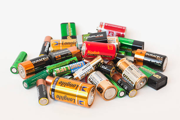 Close up top view of used battery. lot of AA batteries. Electronic hazardous waste, recycling concept