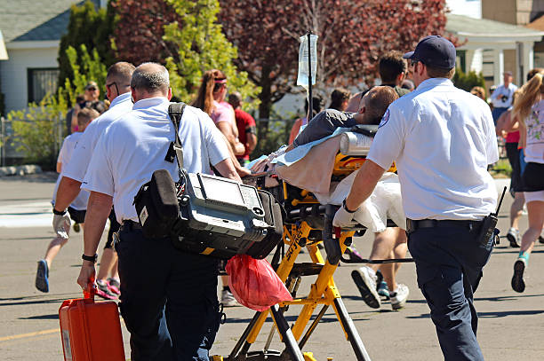 Spokane, USA - May 5, 2013: Runner being treated for exhaustion by EMTs during Bloomsday, an annual timed road race held on the first Sunday of every May.