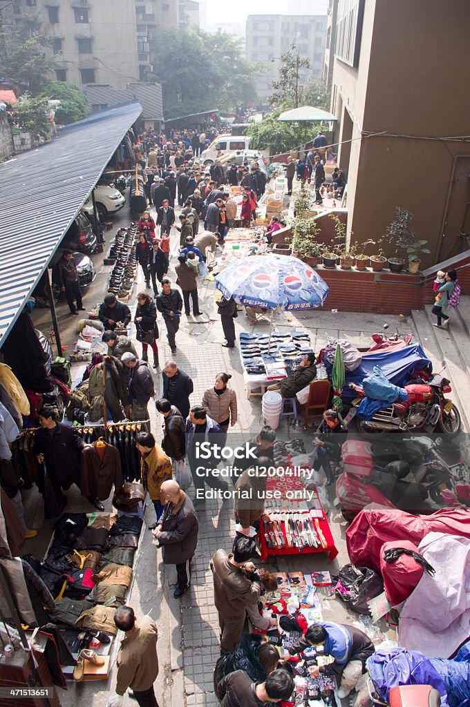 flea markets in china. Chongqing, China- February 23, 2013: There is a flea markets at Zhongxing Road near by Jiefangbei (Monument of Liberation). Some cheap commodity or second-hand item is to be sold here. Every weekend, people flocked to this street to buy or to sale. Buying Stock Photo