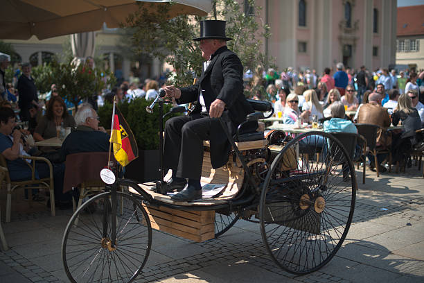 Ludwigsburg, Germany - May 5, 2013: A replica of a Benz Patent-Motorwagen is presented during the eMotionen show on the market square on May 5, 2013 in Ludwigsburg, Germany. The Benz Patent-Motorwagen Number 1 is the first car using a combustion engine and was built in 1886. The eMotionen show was presenting classic cars and modern electronic cars during a shopping Sunday with the stores in Ludwigsburg opening their doors.