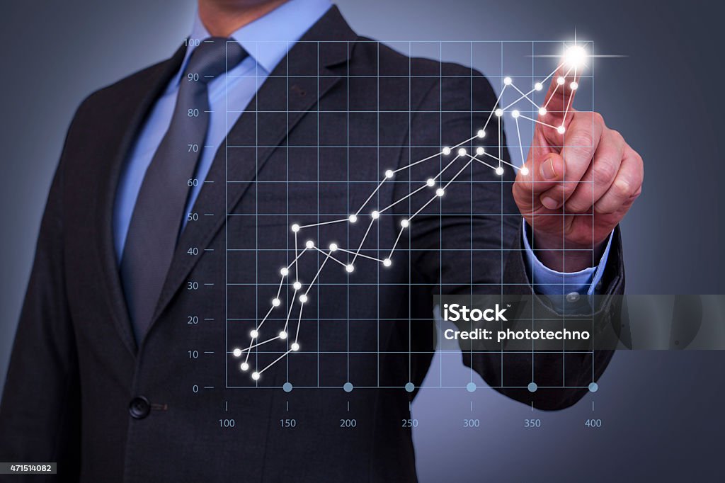 Businessman Touch Graph on Visual Screen Chart Stock Photo