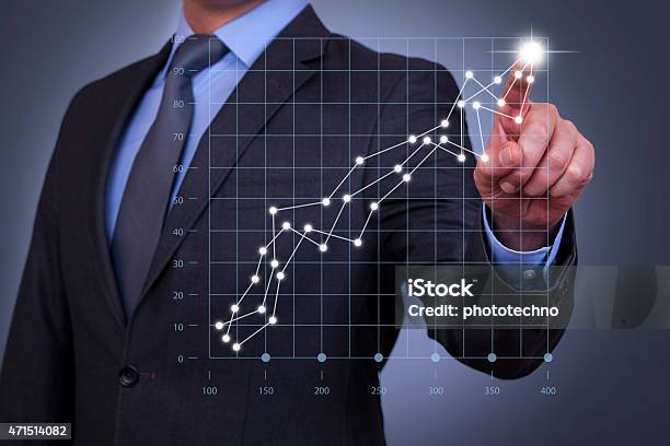 Businessman Touch Graph On Visual Screen Stock Photo - Download Image Now - Chart, Graph, Business