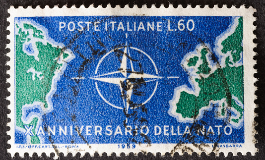 Sandwich, Massachusetts, USA-May 5, 2013: Issued by Italy in 1959, this stamp commemorates the tenth anniversary of NATO