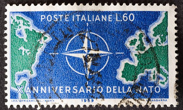 NATO Stamp Sandwich, Massachusetts, USA-May 5, 2013: Issued by Italy in 1959, this stamp commemorates the tenth anniversary of NATO nato stock pictures, royalty-free photos & images