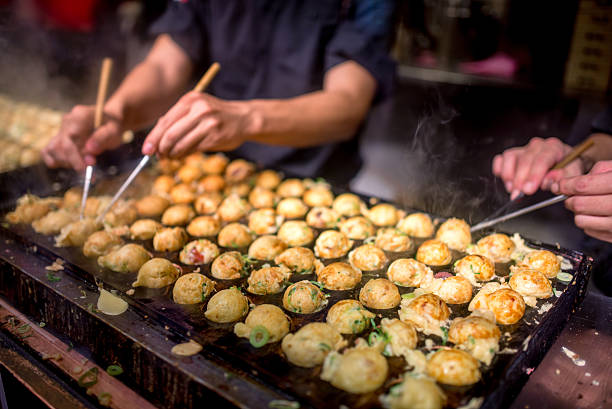 takoyaki process to cooking takoyaki most popular delicious snack of japan osaka prefecture stock pictures, royalty-free photos & images